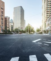 empty asphalt road of a modern city with skyscrapers
